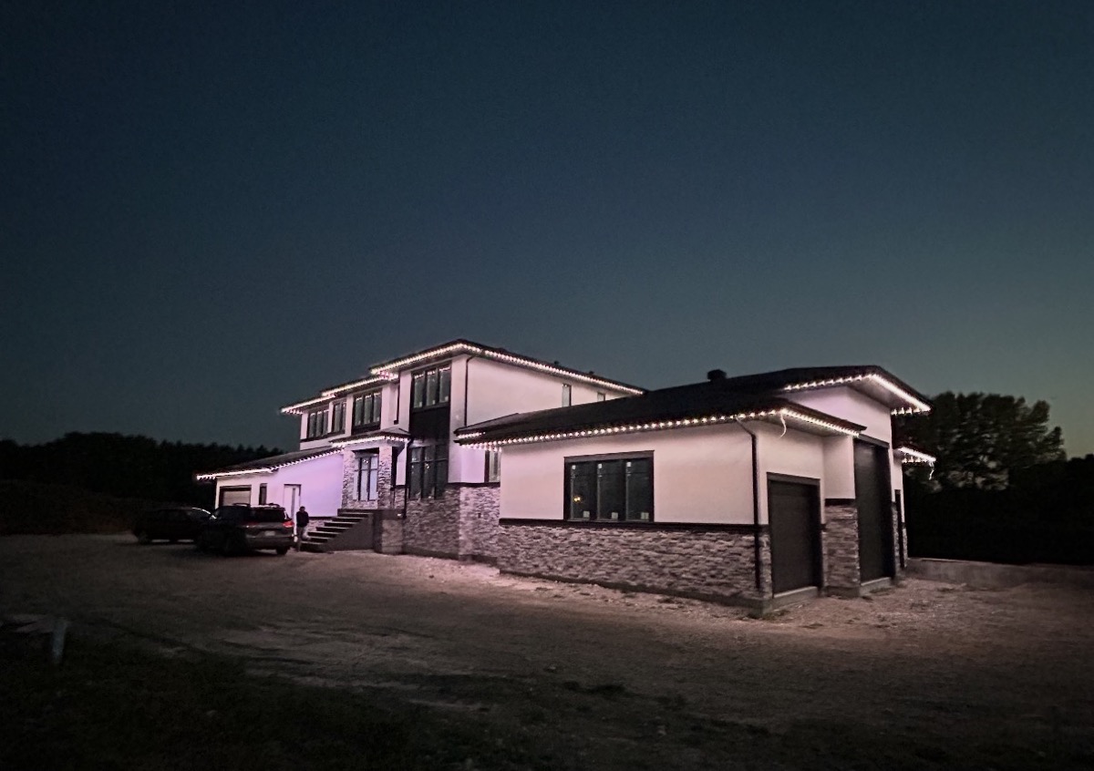 Bright perimeter security lighting on a Calgary home deterring intruders at night